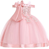 Party dress with bow and appliqué for ages 3 to 10.