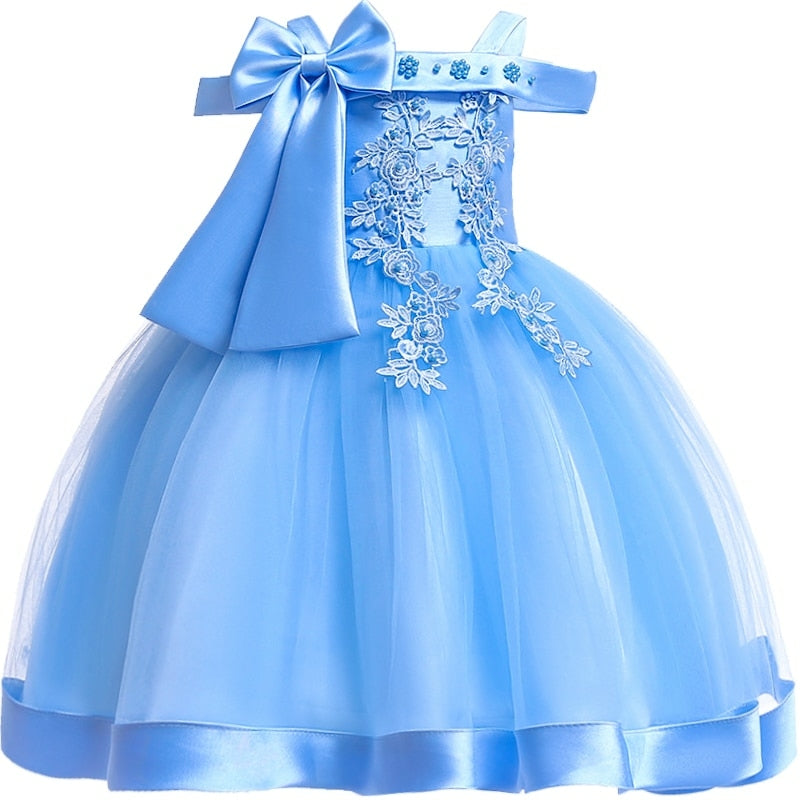 Party dress with bow and appliqué for ages 3 to 10.