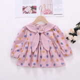 Polka dot dress with sailor-style collar.