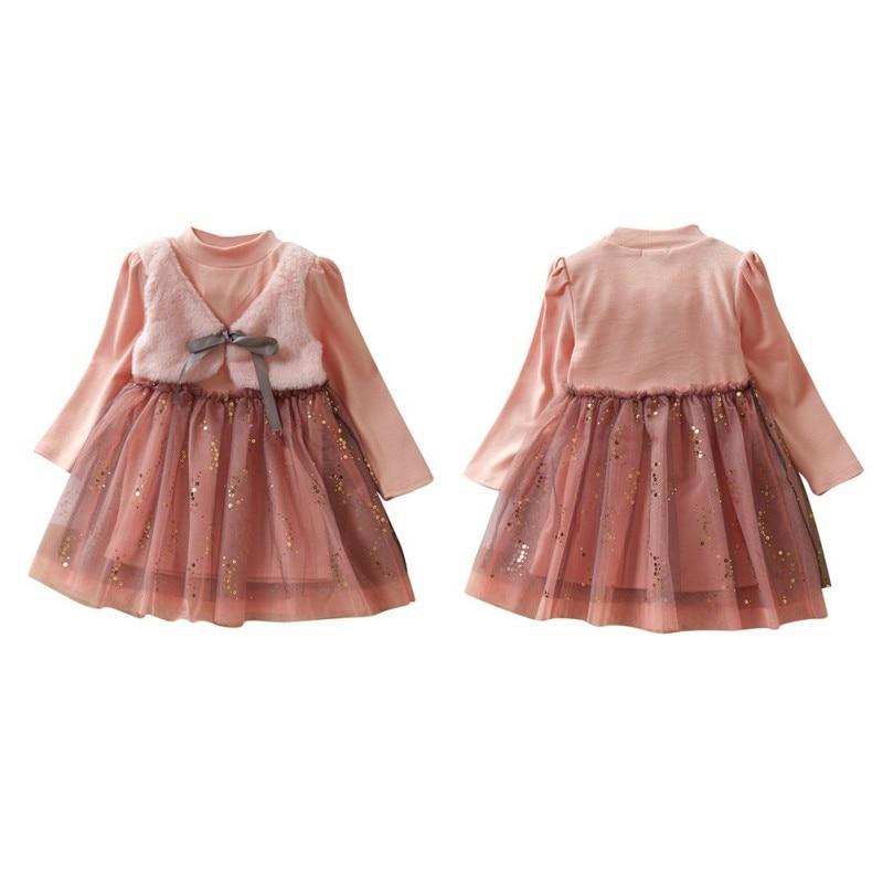 Cute dress with attached plush vest.