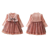 Cute dress with attached plush vest.