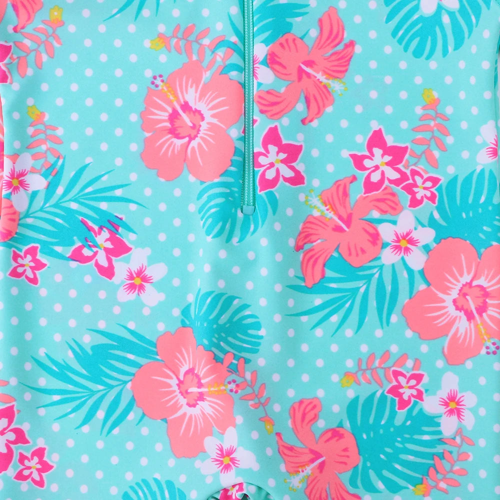 Long-sleeved swimsuit for girls aged 1 month to 6 years, blue floral design, with UPF 50+ protection. Kids UV clothing.