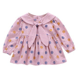 Polka dot dress with sailor-style collar.