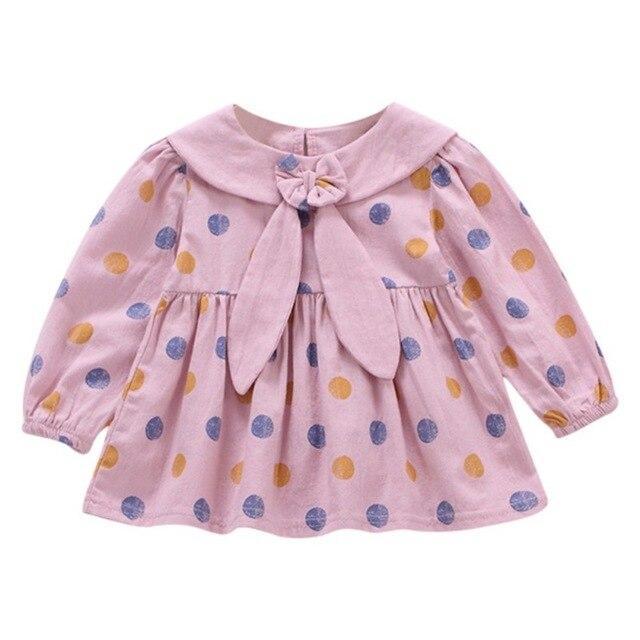 Polka dot dress with sailor-style collar.