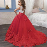 Long Kids party dress made of lace with embroidered flowers, bows, rhinestones, and sequins.