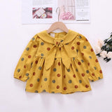 Polka dot dress with sailor-style collar.