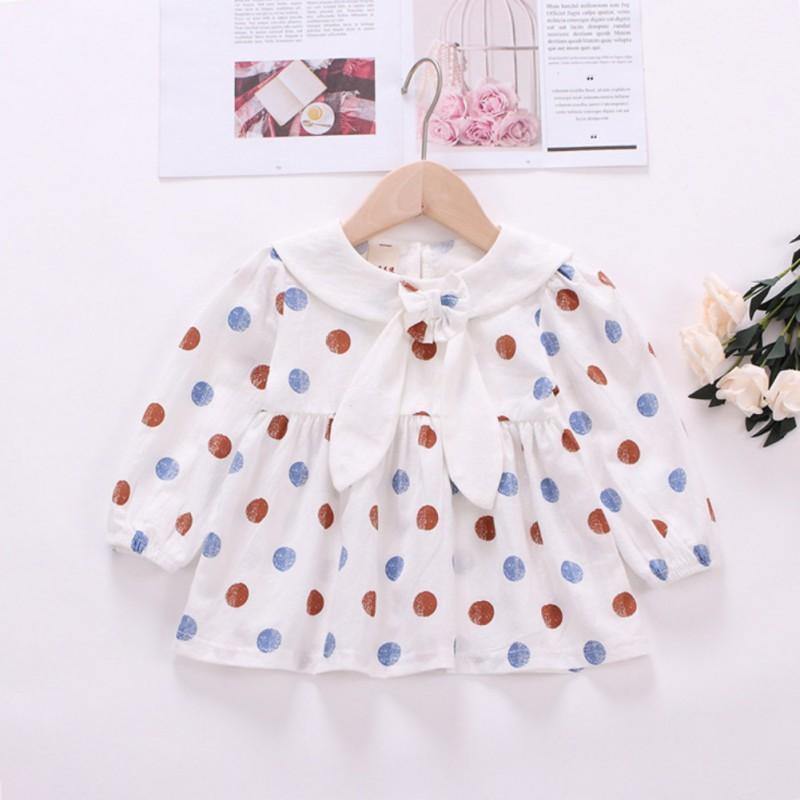Polka dot dress with sailor-style collar.