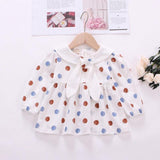 Polka dot dress with sailor-style collar.