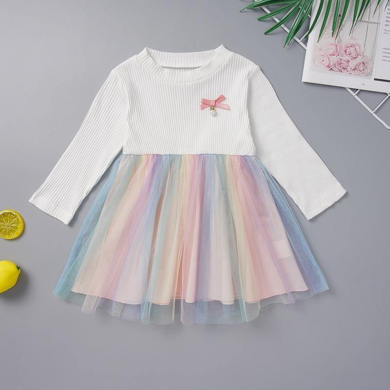 Long-sleeved dress with colorful tulle skirt.