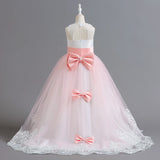 Long Kids party dress made of lace with embroidered flowers, bows, rhinestones, and sequins.