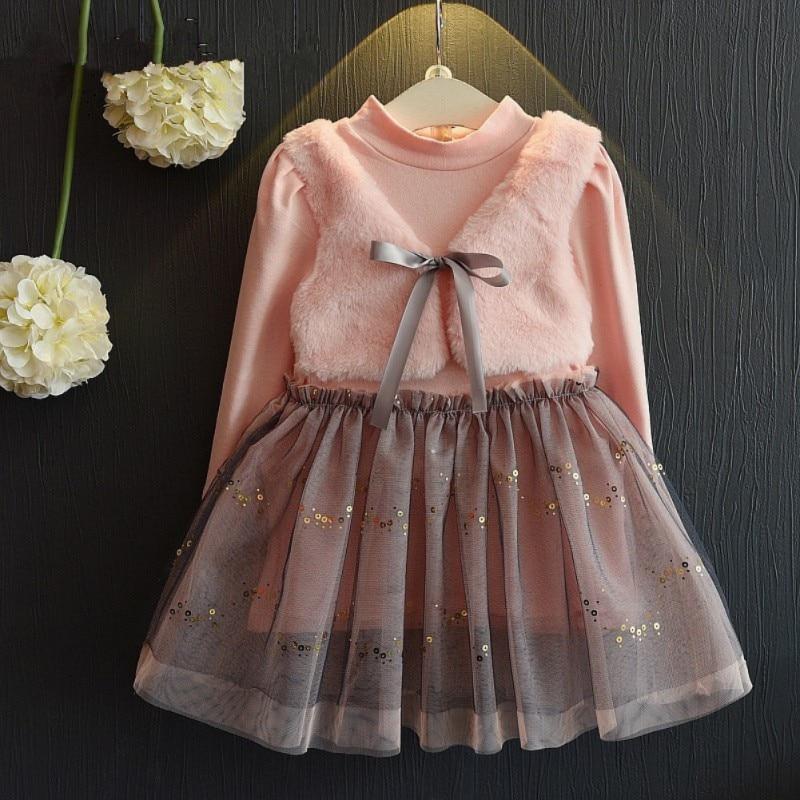 Cute dress with attached plush vest.