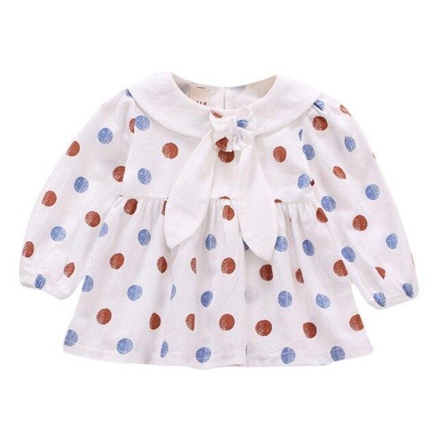 Polka dot dress with sailor-style collar.
