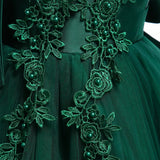 Party dress with bow and appliqué for ages 3 to 10.