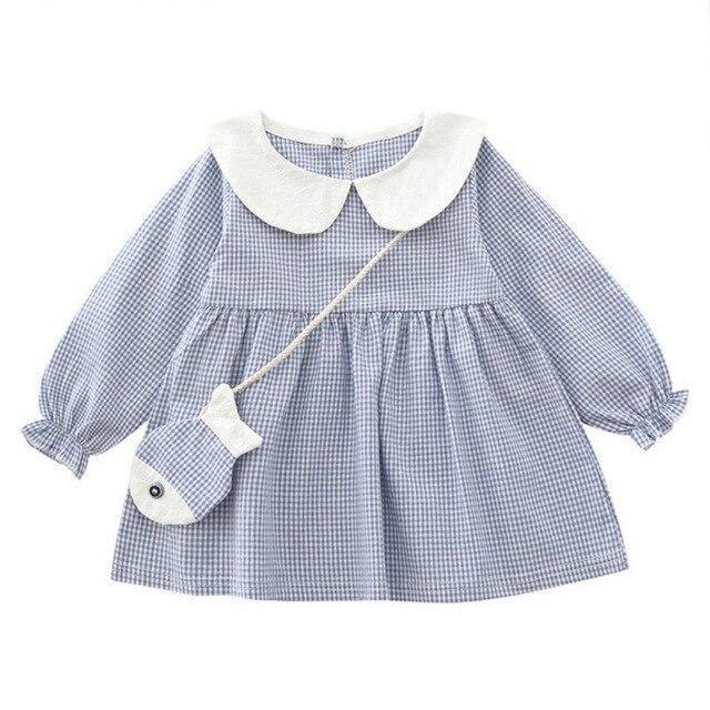 Checkered dress with fish-shaped purse.