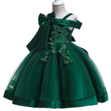 Party dress with bow and appliqué for ages 3 to 10.