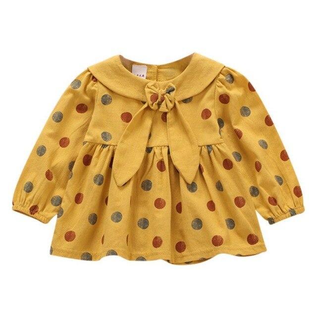 Polka dot dress with sailor-style collar.