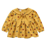 Polka dot dress with sailor-style collar.