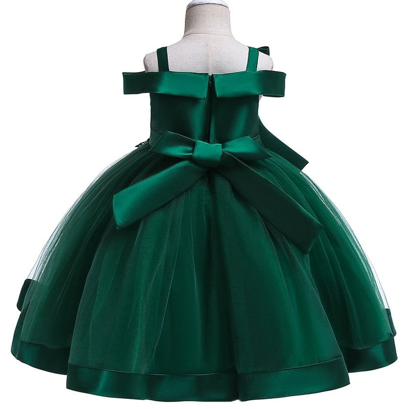 Party dress with bow and appliqué for ages 3 to 10.