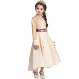 beige winter princess dress for kids with purple waistband and gold pattern accents
