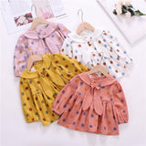 Polka dot dress with sailor-style collar.