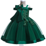 Party dress with bow and appliqué for ages 3 to 10.