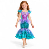 AI-generated studio image of a fictional child wearing Ariel Teal and Purple Tiered Mermaid Dress for Girls on a white background.