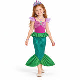 AI-generated studio image of a fictional child wearing Ariel Green Mermaid Tail Dress with Crown and Jewelry on a white background.
