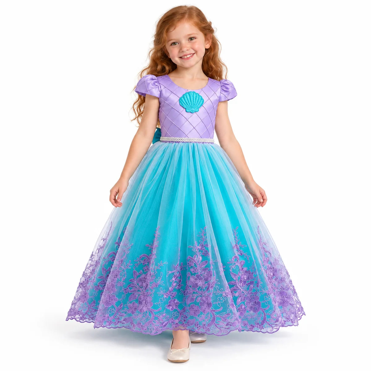 Ariel lavender shell costume dress with puff sleeves and teal skirt with purple floral overlay, worn by a child.