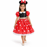 Minnie Mouse red heart-print dress with black bodice, white collar, puff sleeves and matching mouse-ear headband, worn by a child.