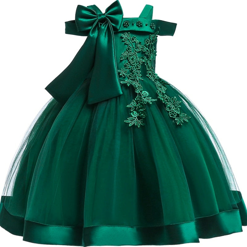 Party dress with bow and appliqué for ages 3 to 10.
