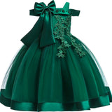 Party dress with bow and appliqué for ages 3 to 10.